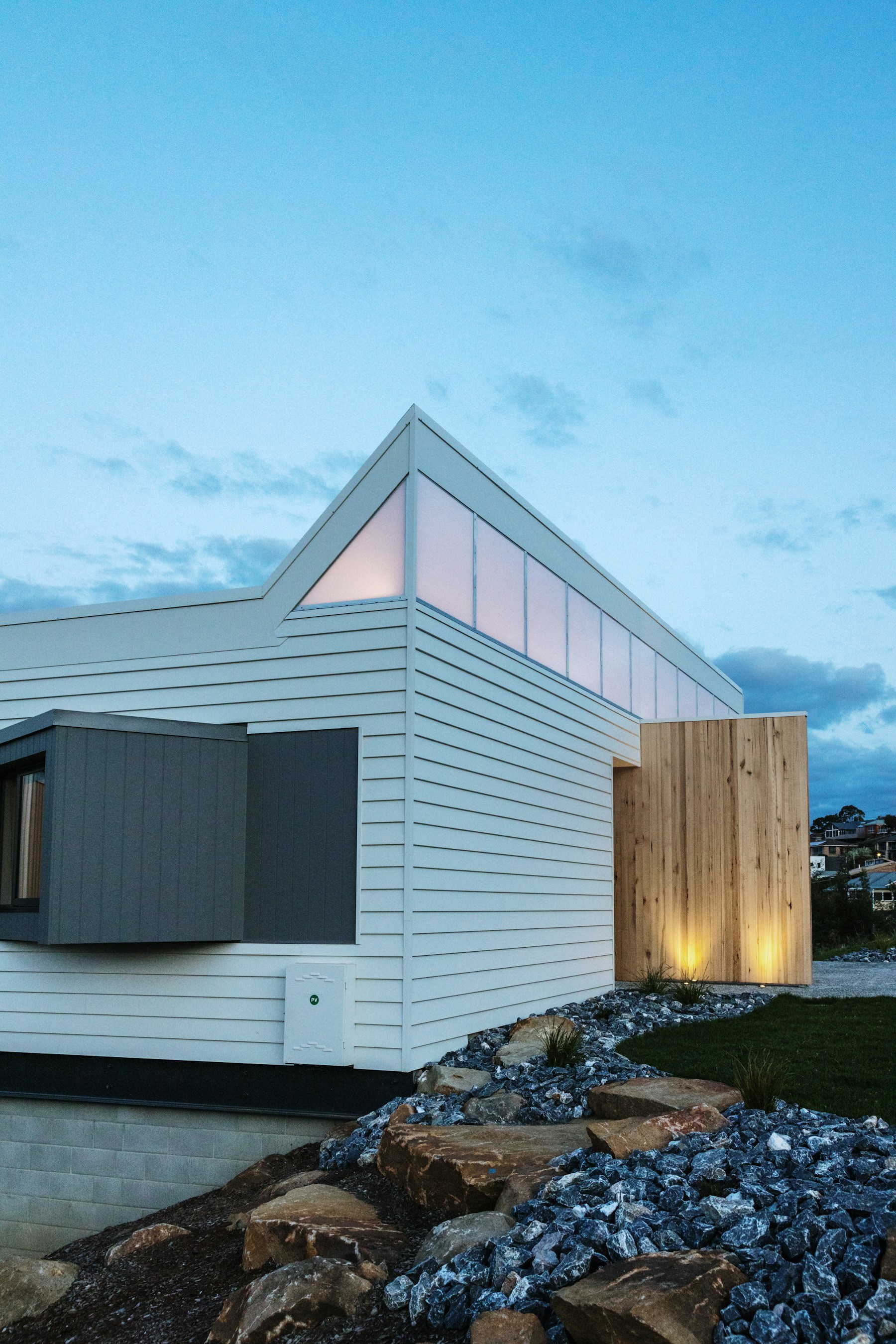 Warm evening light reveals the details of a contemporary home