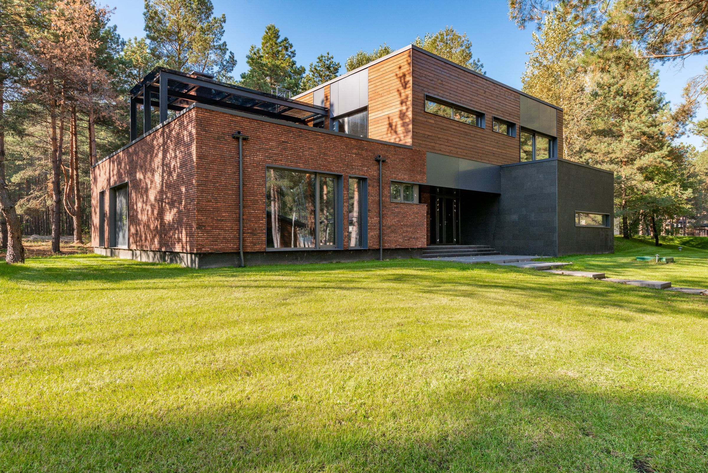 A home shaped by brick, timber, and its natural surroundings